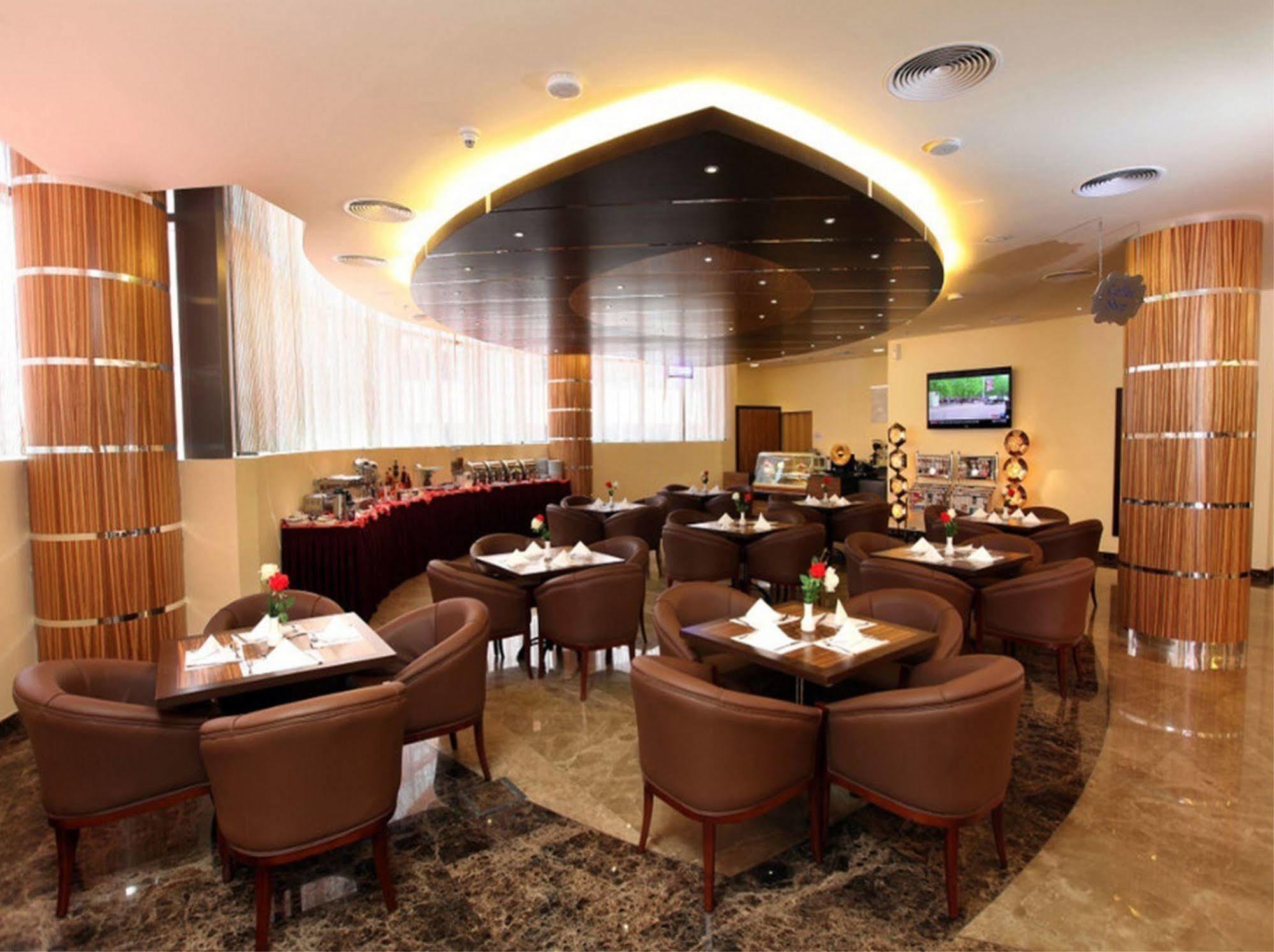 Xclusive Maples Hotel Apartment Dubai Restaurant bilde
